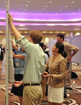 SGIM attendees set up posters and abstracts