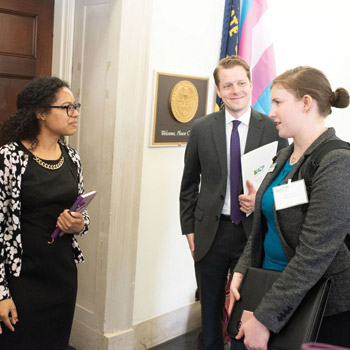 ACP Medical Student Member Jessica Blank right and ACP ResidentslashFellow Member Joel Burnett MD speak with a staff member for Rep Earl Blumenauer D-OR Photo by Nick Klein